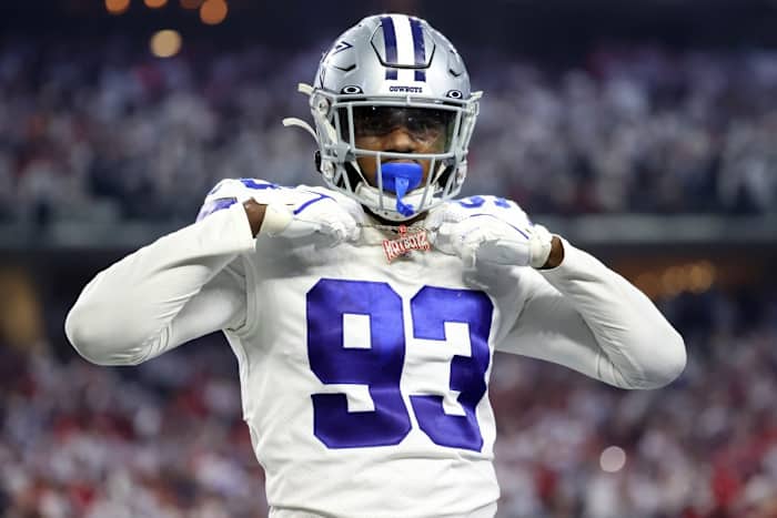 Dallas Cowboys defensive end Tarell Basham (93) holds up his necklace that reads hotbeds during the second half of the NFC Wild Card playoff football game against the San Francisco 49ers at AT&T Stadium.